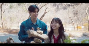 sweet date scene with couple outdoors.