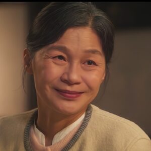  grandmother character smiling warmly.